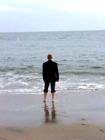 Clayton wades in the water at Coney Island